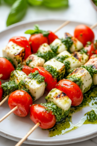 A close-up shot of neatly assembled caprese bacon skewers arranged on a serving plate, each featuring a perfect combination of tomato, mozzarella, basil, and bacon pieces, set on the white marble cooktop, ready for the finishing touches.