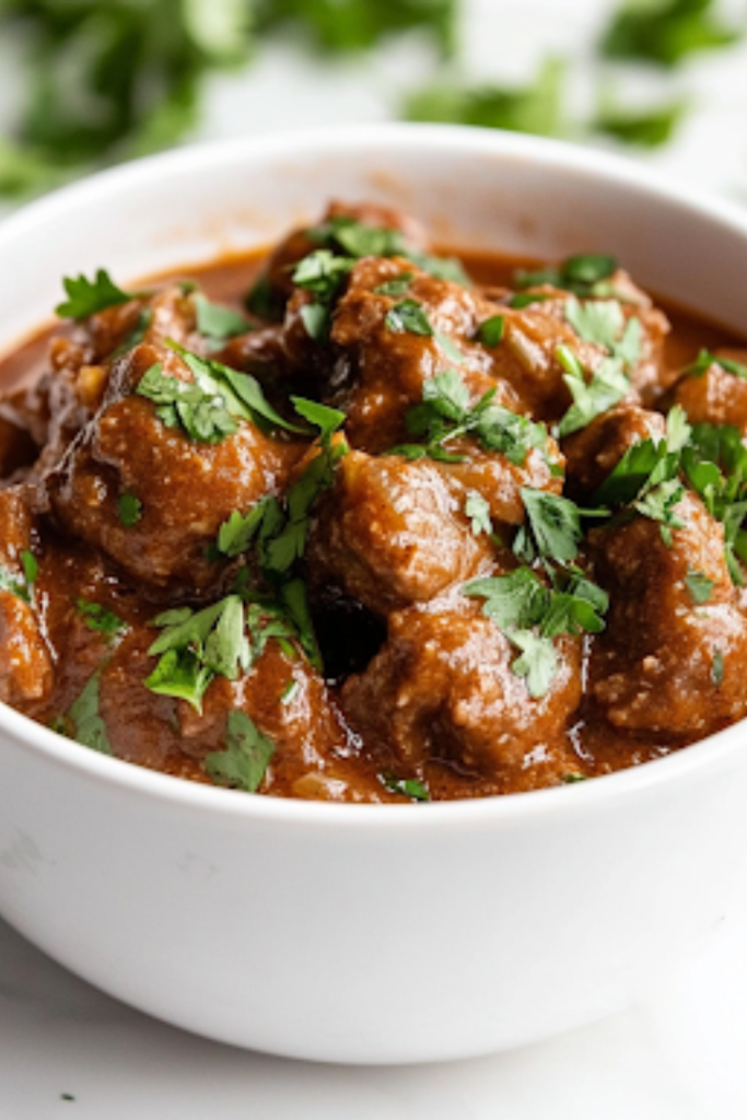 A close-up shot of a rustic bowl filled with steaming slow cooker beef stew, garnished with fresh parsley. A slice of crusty bread rests on the side, ready to soak up the flavorful broth, completing this cozy, homemade meal.