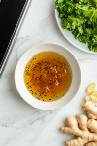 A bowl with honey, soy sauce, minced garlic, and optional fresh ginger whisked together into a flavorful marinade