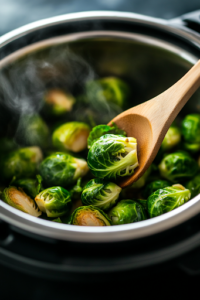 A close-up shot of the Instant Pot being carefully opened, with steam rising to reveal perfectly cooked Brussels sprouts. A wooden spoon gently stirs them, ensuring they are evenly coated in the rich, flavorful broth.