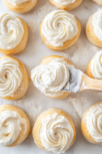 Golden brown crescent roll danishes fresh out of the oven, with the cream cheese filling set in the center