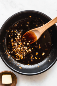 In the same skillet, butter is melted and garlic is sautéed for 1-2 minutes, creating a fragrant base for the sauce. The flavors meld together, providing a rich, aromatic foundation for the creamy sauce that will accompany the salmon.