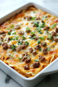 Top-down view of the fully baked breakfast casserole resting on a white marble countertop. The top is golden brown, the cheese is melted and slightly crisped, and the casserole appears set in the center. A spatula is placed next to the dish, ready for serving. The casserole looks warm and inviting.